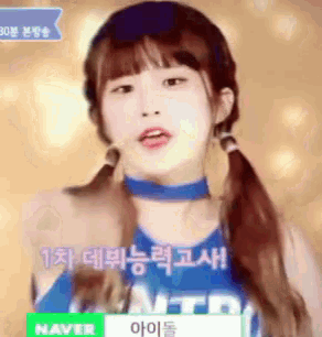 a girl with pigtails is wearing a blue shirt that says naver on it