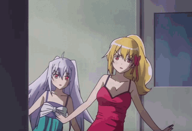 a girl in a red dress stands next to a girl in a blue dress