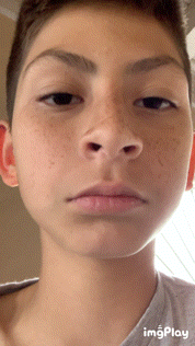 a close up of a young boy 's face with the words imgplay below