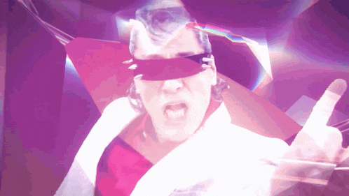 a man wearing sunglasses and blindfolds is giving a thumbs up