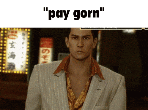 a man in a suit stands in front of a sign that says pay gorn