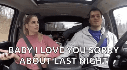 a man and a woman are sitting in a car and the woman is holding the man 's hand .