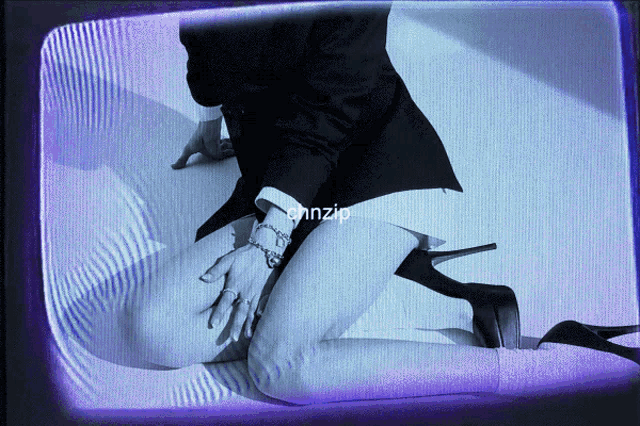 a woman kneeling down with the word ohnzip on the bottom right