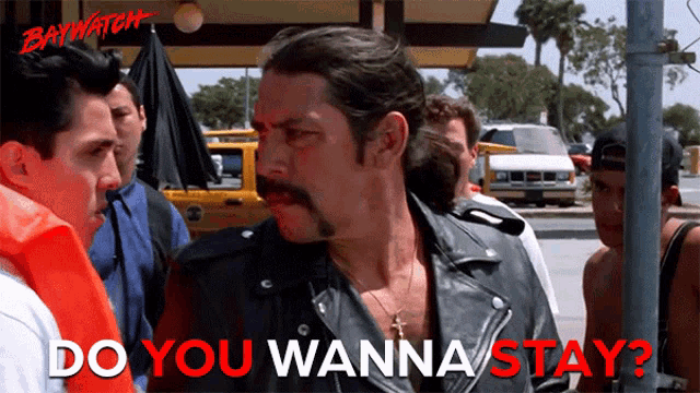 a man in a leather jacket says do you wanna stay in red letters