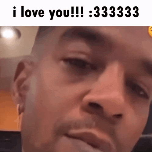 a close up of a man 's face with a caption that says `` i love you ! ''