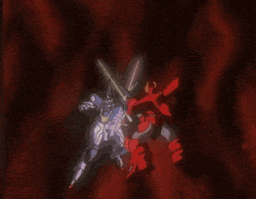 a man is holding a robot in his hand