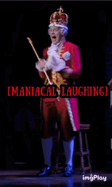 a man in a king 's costume is holding a cane and laughing