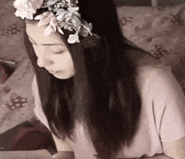 a woman with a flower crown on her head
