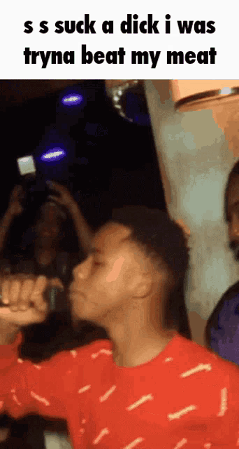 a man in a red sweater says " ss suck a dick i was tryna beat my meat "