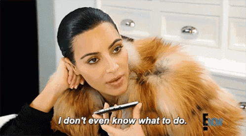 a woman in a fur coat is talking into a microphone and saying i don 't even know what to do