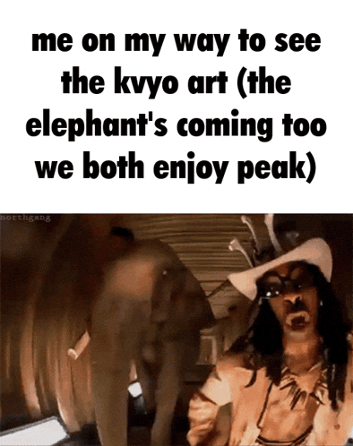 a man in a cowboy hat is standing in front of an elephant and says me on my way to see the kvyo art