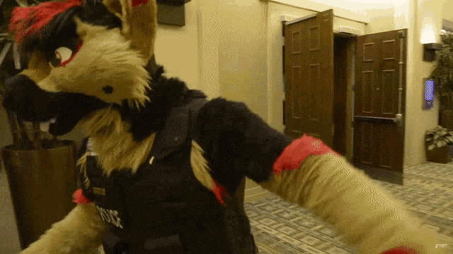 a furry mascot wearing a black vest with the word police on it