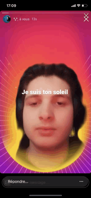 a phone screen shows a man 's face with the words je suis ton soleil on it