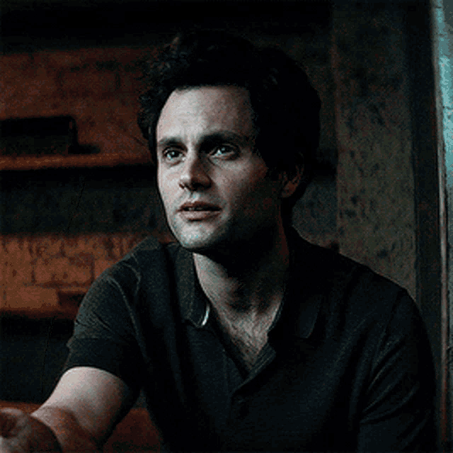 a man with his eyes closed and his hand on his face