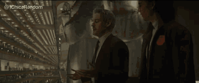 two men in suits and ties are standing next to each other in a room with the words @ 1chica random on the bottom