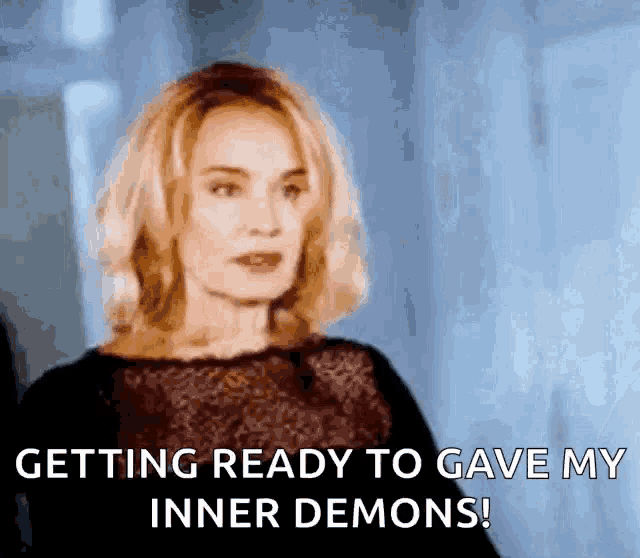 a woman in a black dress is getting ready to give her inner demons .