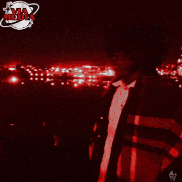 a red and black photo of a person with the word media on the bottom