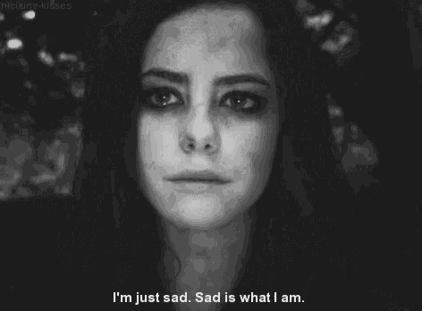 a black and white photo of a woman crying with the caption i 'm just sad sad is what i am .