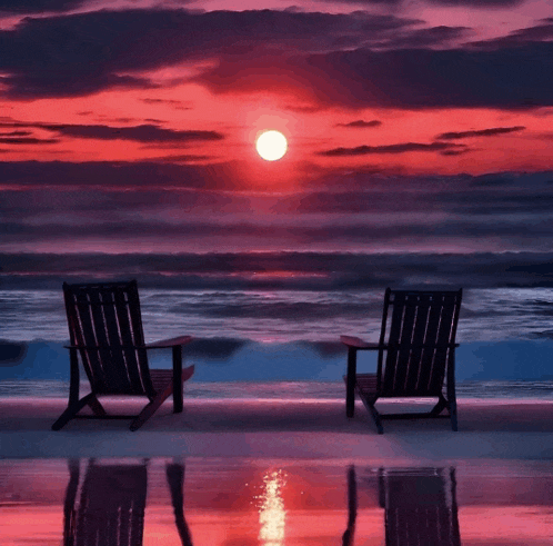 two chairs on a beach at sunset with the sun shining through the clouds