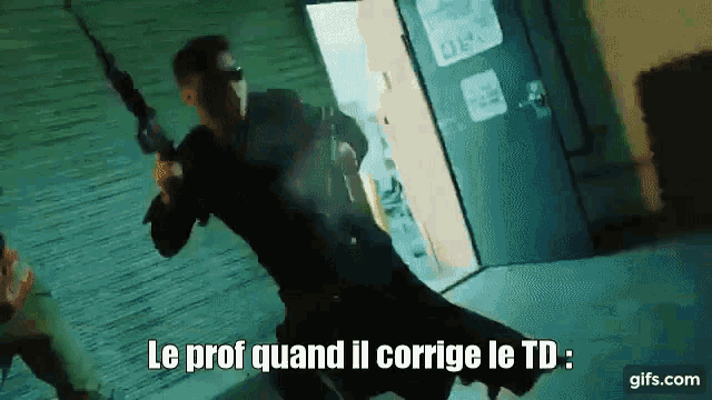 a man holding a gun with the words le prof quand il corrige le td