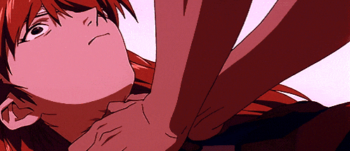 a close up of a person 's face with red hair and a hand on it