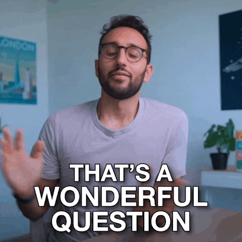 a man with glasses and a beard says " that 's a wonderful question "