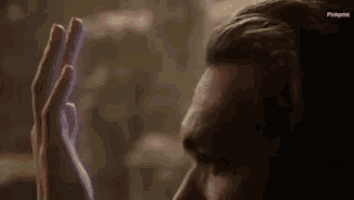 a close up of a man 's face with pinkprint written on the bottom right