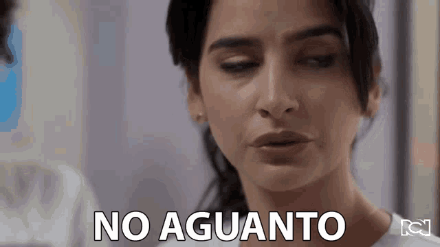 a close up of a woman 's face with the words no aguanto written on it .