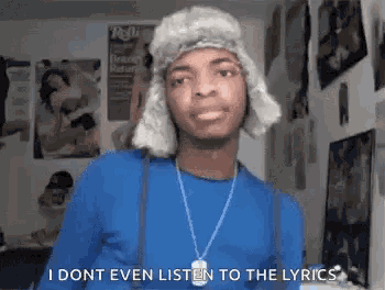 a man wearing a fur hat and suspenders says i dont even listen to the lyrics