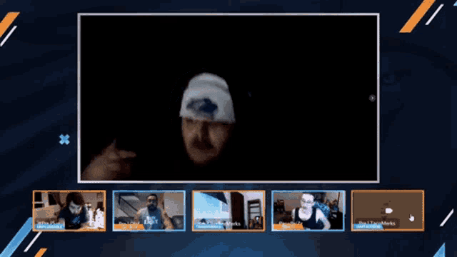 a screen shows a man wearing a white hat with a blue shark on it
