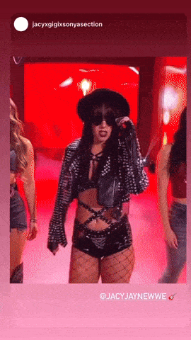 a picture of a woman holding a microphone with the words jacyxgigixsonyasection at the top