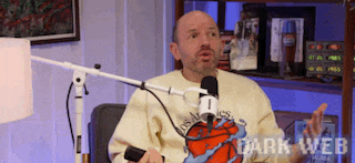 a man is sitting in front of a microphone with the words dark web written on the bottom