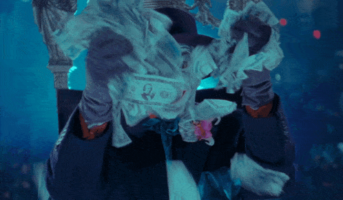 a man in a joker costume with a flower in his tie