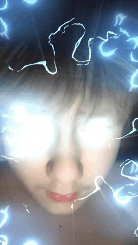 a close up of a person 's face with lightning coming out of it