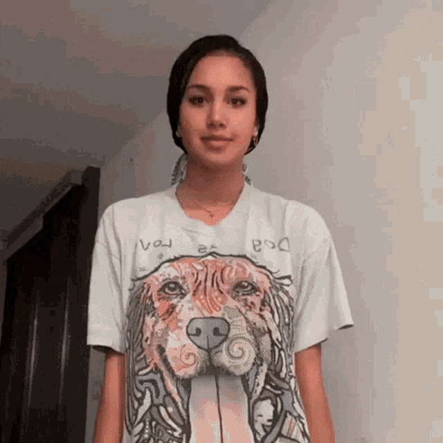 a woman wearing a white t-shirt with a dog on it
