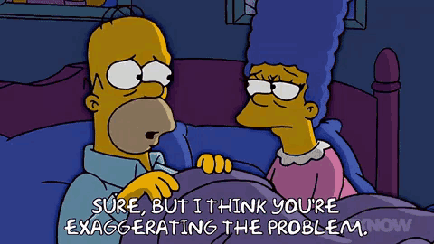 a cartoon of homer simpson and marge simpson in bed
