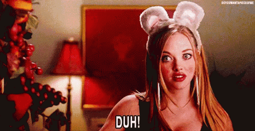 a woman with bunny ears on her head is making a funny face and saying duh .