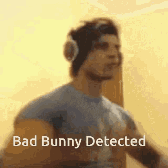 a man wearing headphones says bad bunny detected in a blurry image