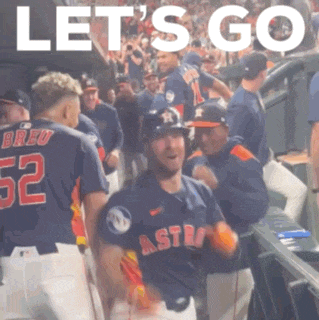 a group of baseball players are standing in a dugout with the words let 's go in the background