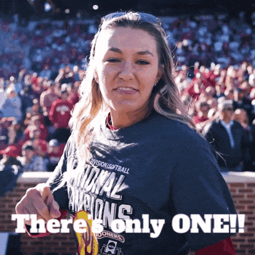 a woman wearing a national softball champions shirt