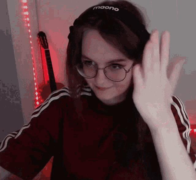 a girl wearing glasses and headphones with the word moono on them