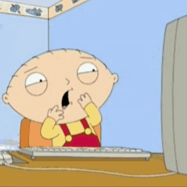 a cartoon character sitting in front of a computer with his mouth open