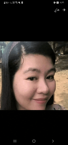 a close up of a woman 's face on a cell phone with the time of 4:37