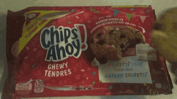 a person is holding a bag of chips ahoy chewy tendres candy