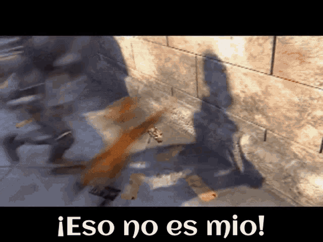 a blurred image of a brick wall with the words eso no es mio below it