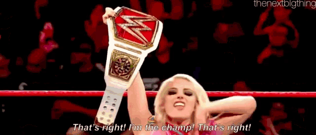 a woman is holding a wrestling championship belt and says that 's right i 'm the champ