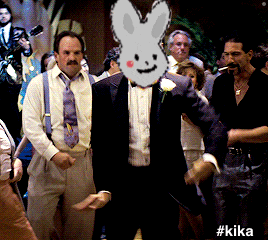 a man with a bunny face on his face is surrounded by other men