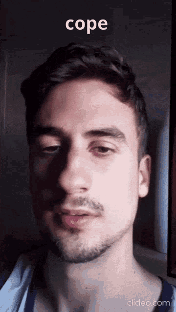 a close up of a man 's face with the word cope in the corner