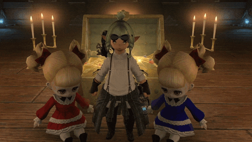 two dolls standing in front of a treasure chest