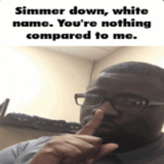 a man with glasses holds his finger to his nose and says simmer down white name